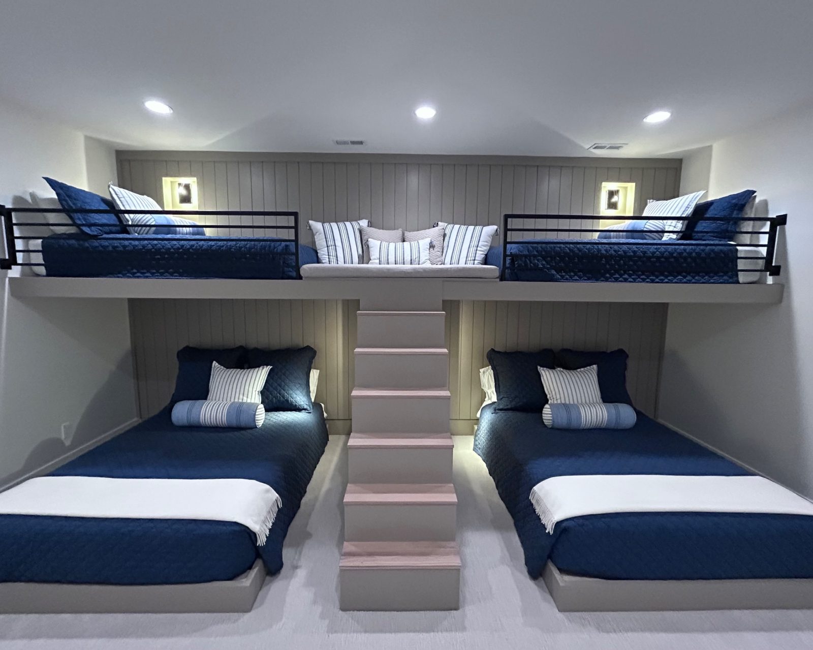 Four-bed custom bunk room with shiplap and navy bedding — Aucamp residence