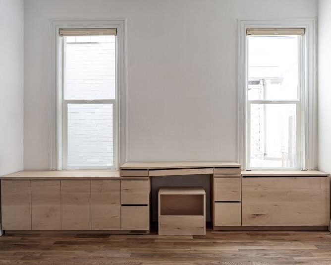 Avenues project — full-wall maple desk, storage system with natural light